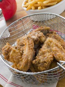Royalty Free Photo of Southern Fried Chicken in a Basket with Fries