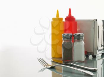 Royalty Free Photo of a Diner Counter With Condiments