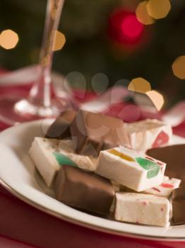Royalty Free Photo of a Plate of Chocolate Dipped and Plain Nougat