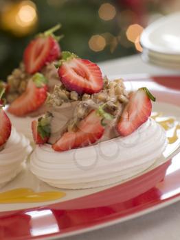 Royalty Free Photo of Meringue Nests Filled With a Sweet Chestnut Cream and Strawberries