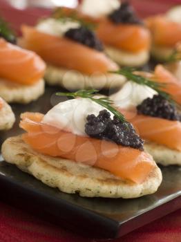 Royalty Free Photo of Smoked Salmon Blinis Canapes s with Sour Cream and Caviar