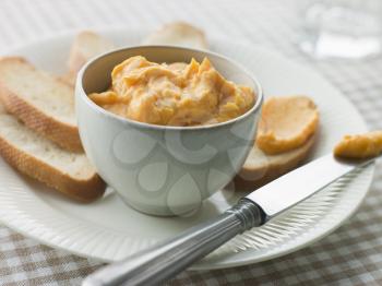 Royalty Free Photo of a Bowl of Rouille with Croutes