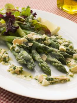 Royalty Free Photo of Asparagus Spears with Polonaise Vinaigrette and Salad Leaves