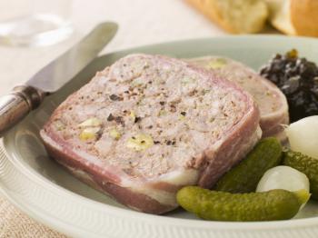 Royalty Free Photo of Pate Campagne with Cornichons and Confit Onions