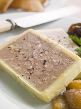 Royalty Free Photo of Chicken Liver and Foie Gras Parfait with Caramelised Shallots and Melba Toast