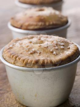 Royalty Free Photo of Black Truffled Pork and Pistachio Pies