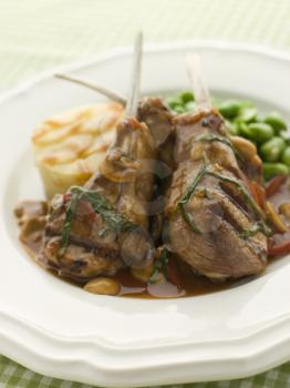 Royalty Free Photo of Grilled Lamb Cutlets Chasseur Sauce Pomme Anna and Baby Broad Beans