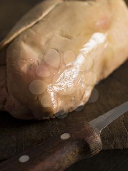 Royalty Free Photo of a Lobe of Foie Gras on a Chopping Board