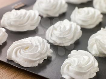 Royalty Free Photo of a Tray of Piped Meringues
