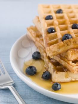 Royalty Free Photo of Waffles With Caramel Syrup and Blueberries