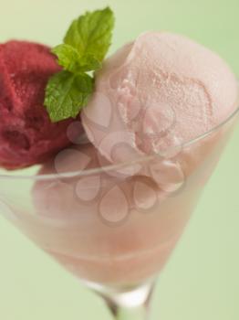 Royalty Free Photo of a Cocktail Glass with a Trio of Sorbets