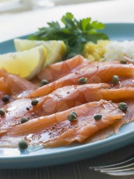 Royalty Free Photo of Scottish Smoked Salmon With Lemon Capers and Egg