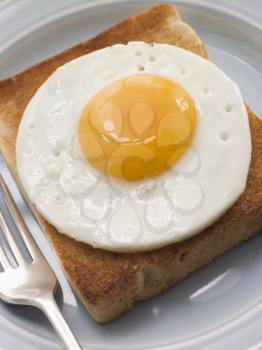 Royalty Free Photo of a Fried Egg on White Toast