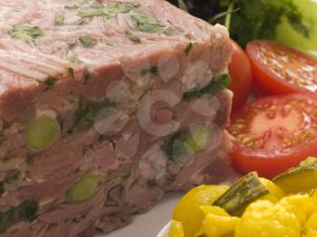 Royalty Free Photo of Jellied Gammon and Leek Terrine with Piccalilli