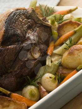 Royalty Free Photo of Roast Leg of Spring Lamb With Roast Potatoes and Vegetables