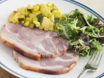 Royalty Free Photo of Boiled Collar of Bacon with Piccalilli and Salad