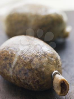 Royalty Free Photo of Whole Haggis on a Chopping Board