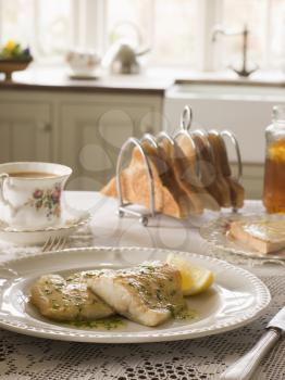 Royalty Free Photo of Smoked Haddock with Herb Butter and Toast