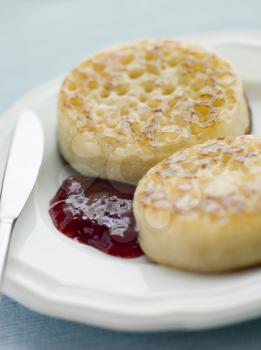 Royalty Free Photo of Crumpets with Butter and Jam