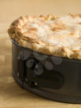 Royalty Free Photo of a Deep Apple Pie in a Baking Tin