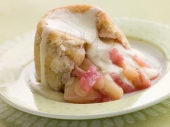 Royalty Free Photo of a Hot Apple and Rhubarb Charlotte with Custard