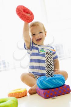 Royalty Free Photo of a Baby Playing With a Toy