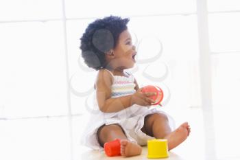 Royalty Free Photo of a Baby Playing With Stacking Blocks