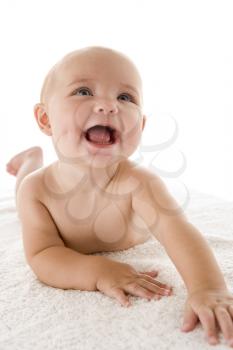 Royalty Free Photo of a Baby Lying on Its Stomach