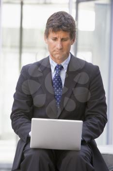 Royalty Free Photo of a Businessman With a Laptop