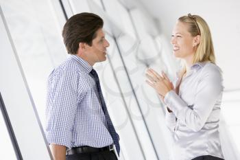 Royalty Free Photo of a Man and Woman Talking
