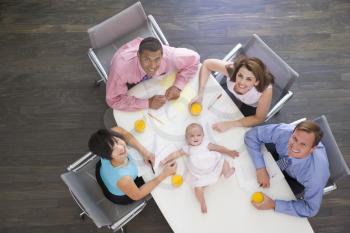 Royalty Free Photo of People and a Baby in the Boardroom