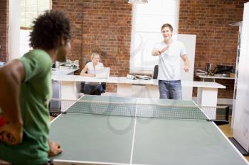 Royalty Free Photo of Men Playing Ping Pong