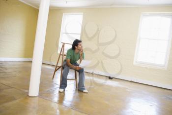 Royalty Free Photo of a Man in an Empty Room