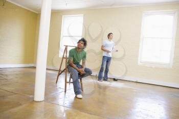 Royalty Free Photo of Two Men in an Empty Room