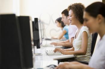 Royalty Free Photo of Four People in a Computer Room