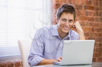 Royalty Free Photo of a Guy With a Laptop