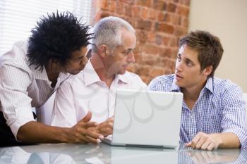 Royalty Free Photo of Three Men at a Laptop
