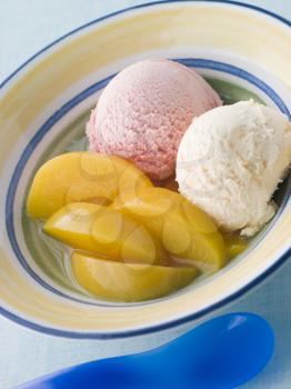 Royalty Free Photo of a Bowl of Peaches and Ice Cream