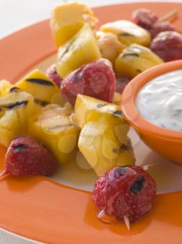 Royalty Free Photo of Caramelised Fruit Brochette With Honey Creme Fraiche