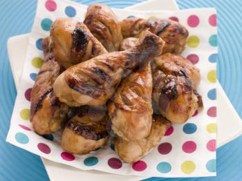 Royalty Free Photo of Barbecue and Honey Glazed Chicken Drumsticks