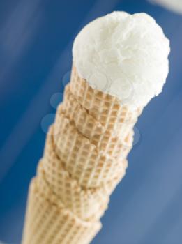 Royalty Free Photo of a Vanilla Ice Cream Scoop in a Wafer Cone