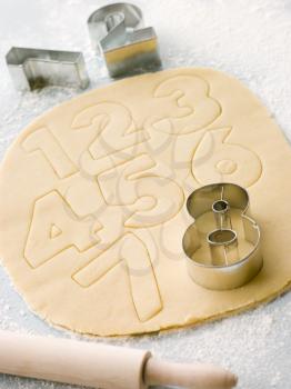 Royalty Free Photo of Cutting Out Number Shape Biscuits