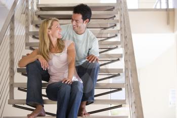 Royalty Free Photo of a Couple on a Staircase