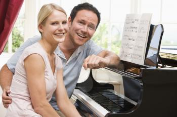 Royalty Free Photo of a Couple at the Piano