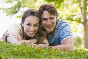 Royalty Free Photo of a Couple Lying on the Grass