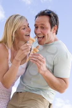 Royalty Free Photo of a Couple Eating Ice Cream