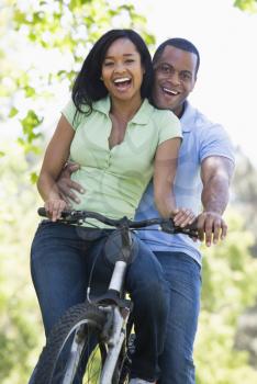 Royalty Free Photo of a Couple on a Bike