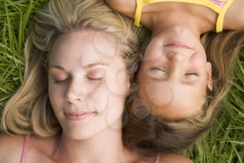 Royalty Free Photo of a Mother and Daughter Lying in the Grass