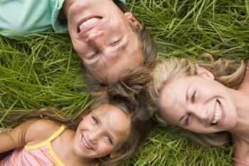 Royalty Free Photo of a Family Lying in the Grass