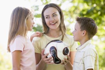 Royalty Free Photo of a Woman and Two Children Outside
